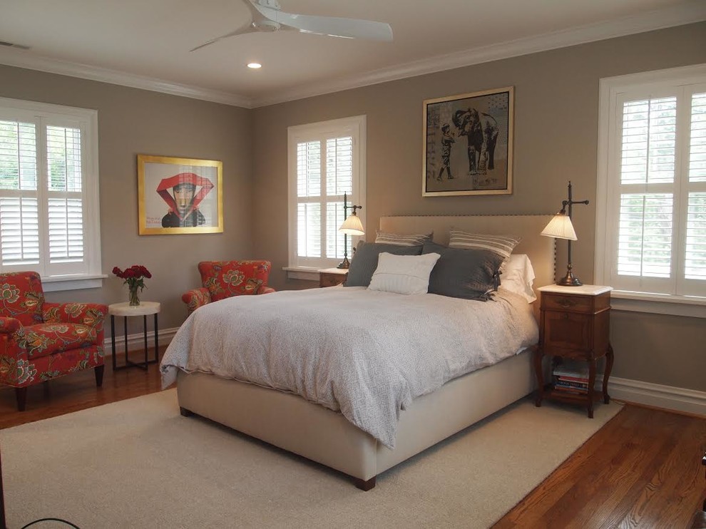 Inspiration for a large traditional master bedroom in St Louis with grey walls, medium hardwood flooring and no fireplace.