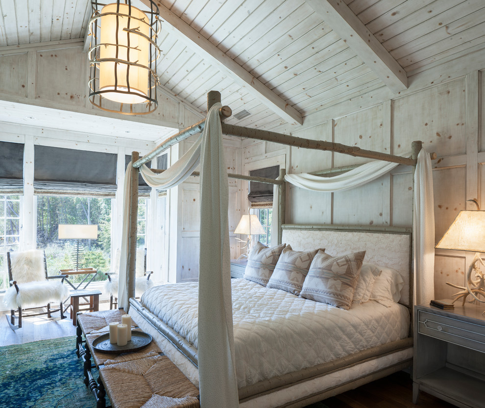 Photo of an expansive rustic master bedroom in Grand Rapids.