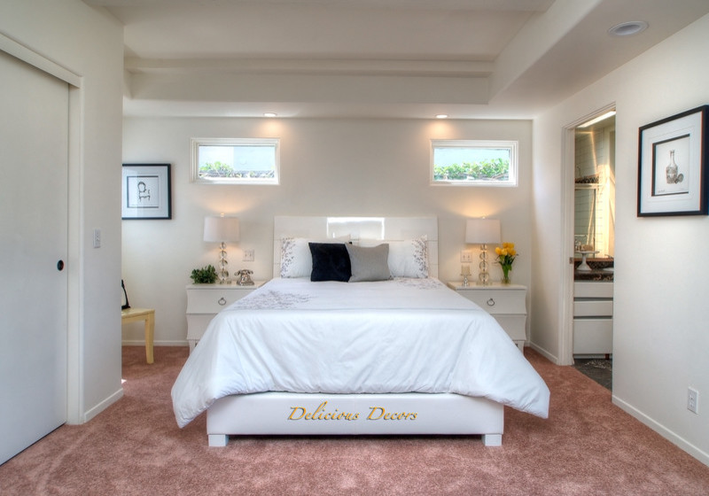 Mediterranean bedroom in Santa Barbara with carpet.