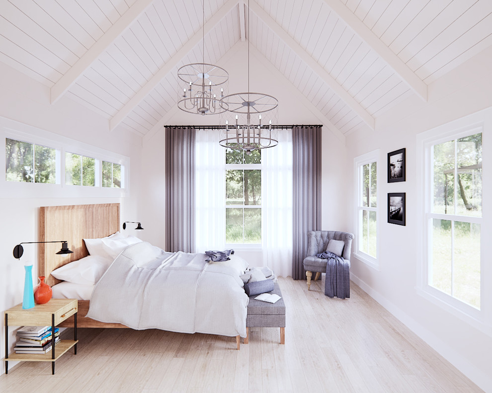 Medium sized farmhouse master bedroom in Austin with white walls, laminate floors and beige floors.