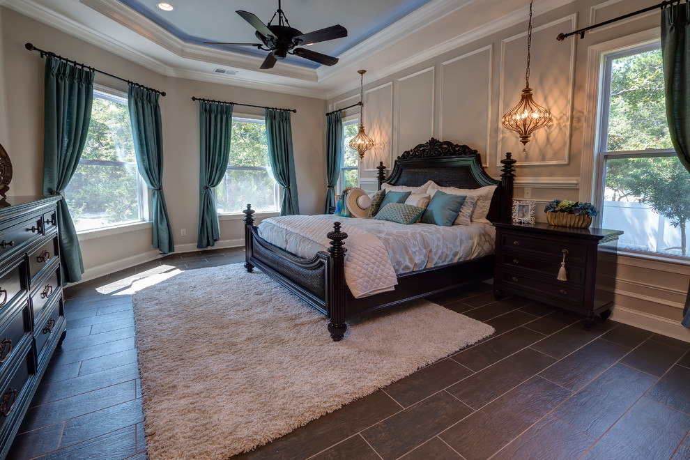 Inspiration for a mid-sized timeless master porcelain tile and brown floor bedroom remodel in Jacksonville with white walls