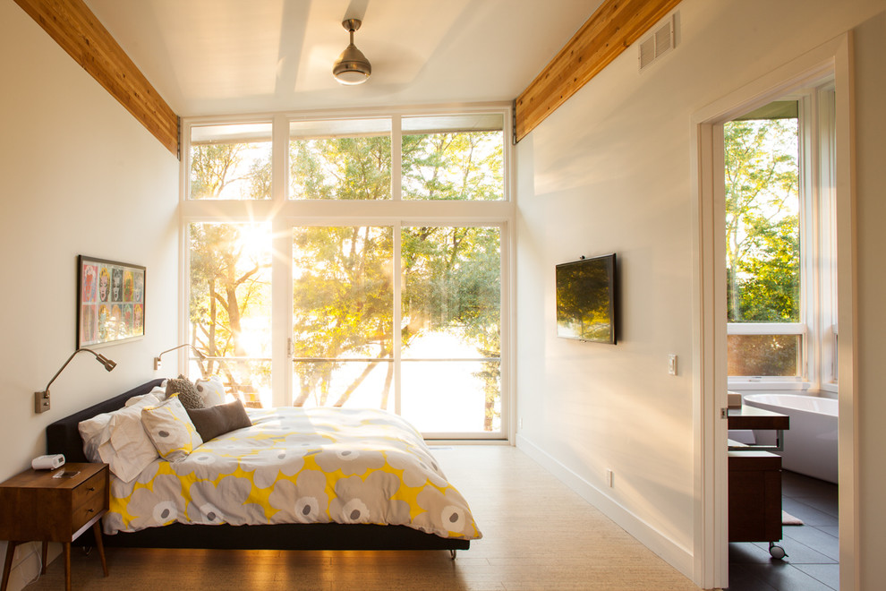 Bedroom - contemporary dark wood floor bedroom idea in Grand Rapids with beige walls