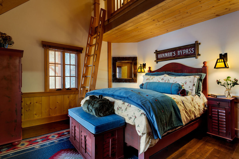 Photo of a large rustic master bedroom in Portland Maine with brown walls, dark hardwood flooring and no fireplace.