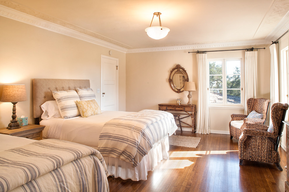 Bedroom in Santa Barbara with beige walls and dark hardwood flooring.