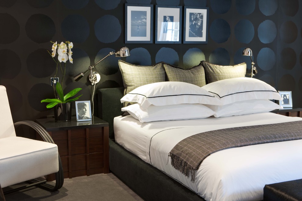 This is an example of a contemporary bedroom in London with black walls.