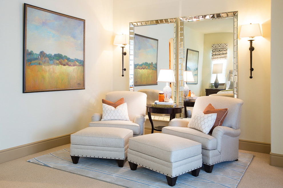 This is an example of an expansive classic master bedroom in San Diego with beige walls and carpet.