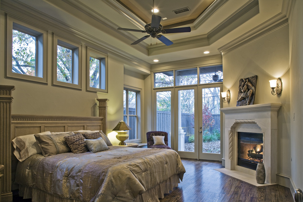 Photo of a mediterranean bedroom in Dallas with a corner fireplace.