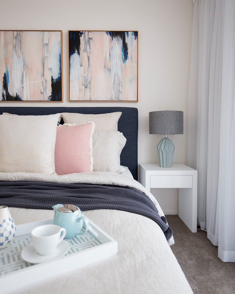 This is an example of a classic master bedroom in Gold Coast - Tweed with beige walls and carpet.