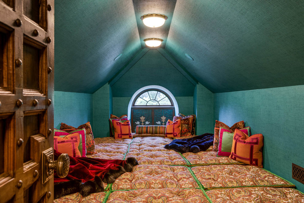 This is an example of a world-inspired bedroom in Providence with green walls.