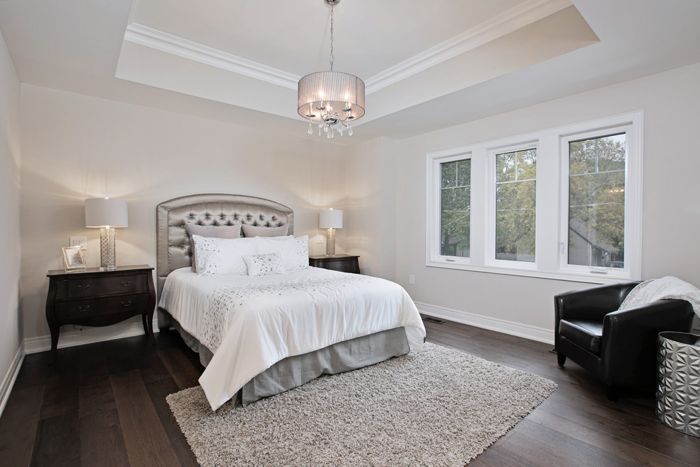 Small classic master bedroom in Toronto with white walls, dark hardwood flooring, no fireplace and brown floors.
