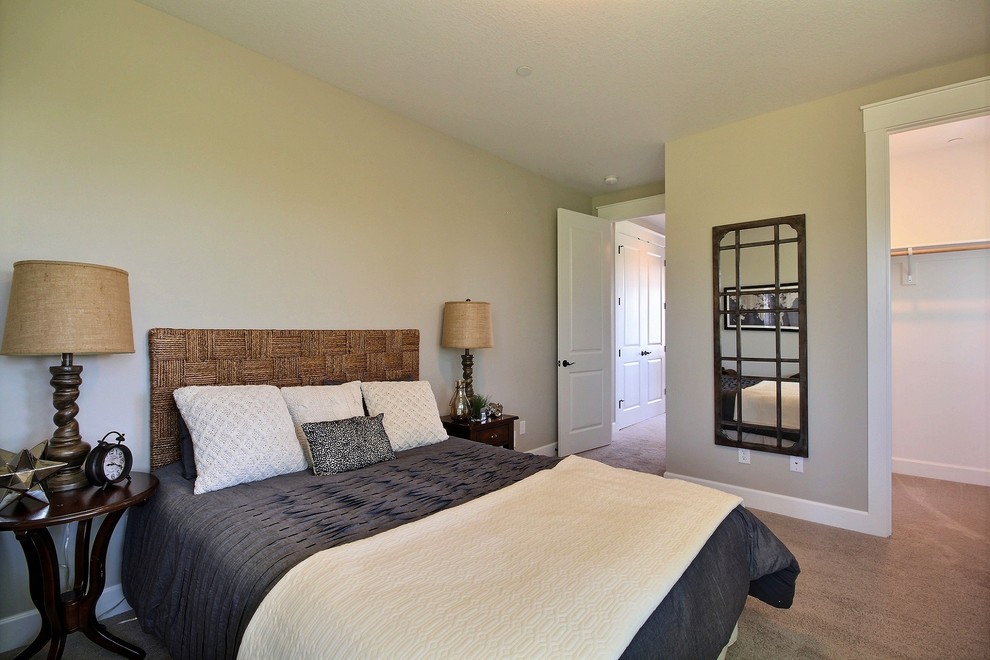 Large contemporary guest and grey and cream bedroom in Portland with beige walls, carpet and beige floors.