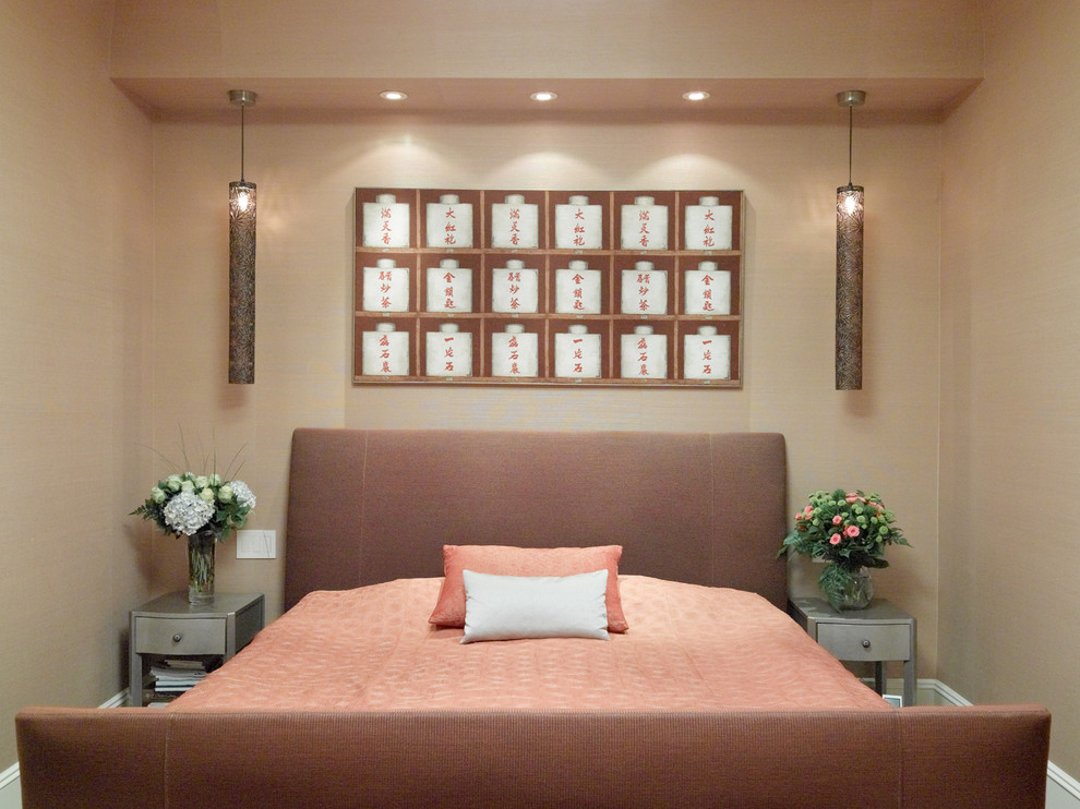 Photo of a small world-inspired guest and grey and pink bedroom in New York with beige walls, no fireplace and light hardwood flooring.