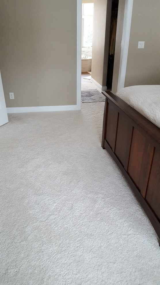 This is an example of an expansive traditional bedroom in Other with porcelain flooring.