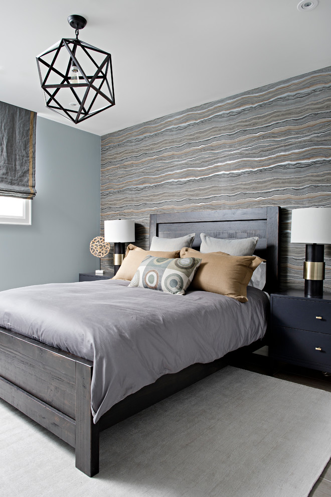 Large classic guest and grey and brown bedroom in Toronto with grey walls, light hardwood flooring and brown floors.