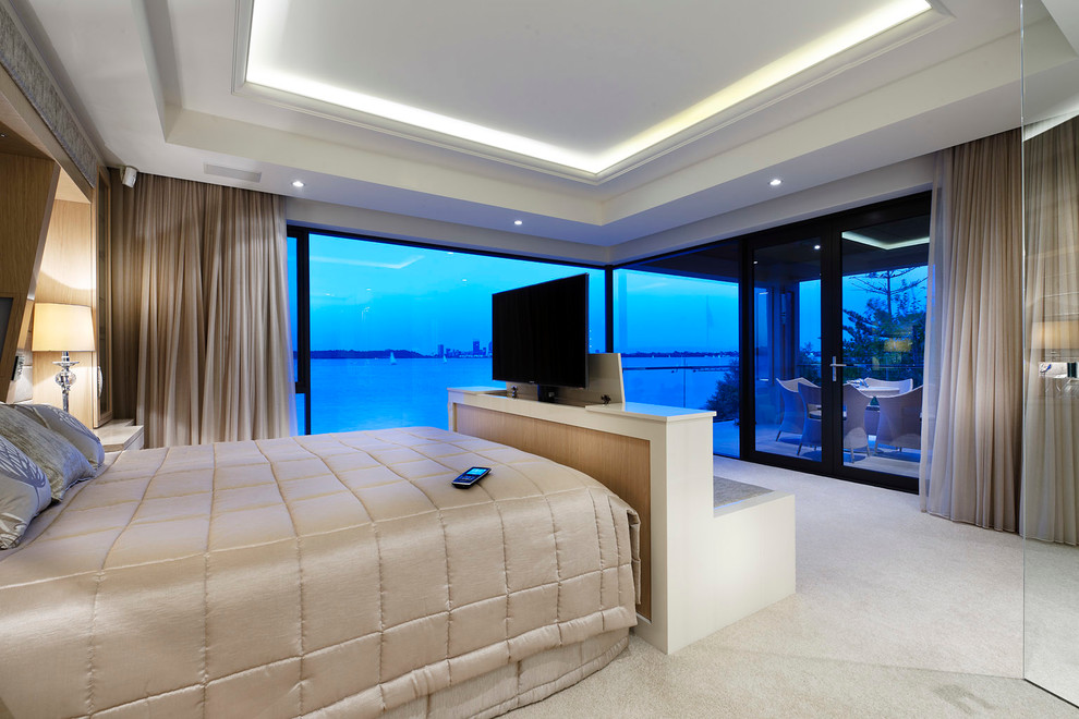 Bedroom - mid-sized contemporary master carpeted bedroom idea in Perth with beige walls