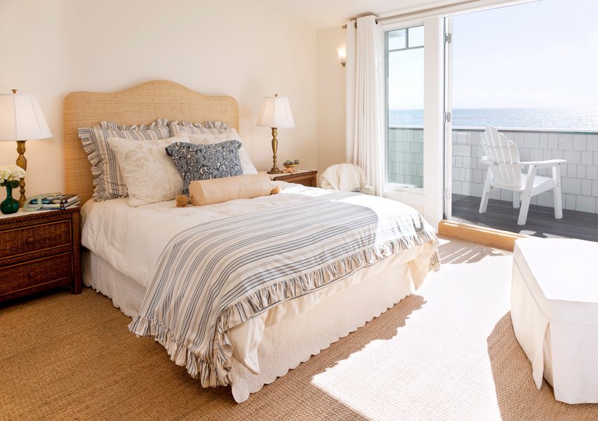 This is an example of a large nautical guest bedroom in San Francisco with white walls.