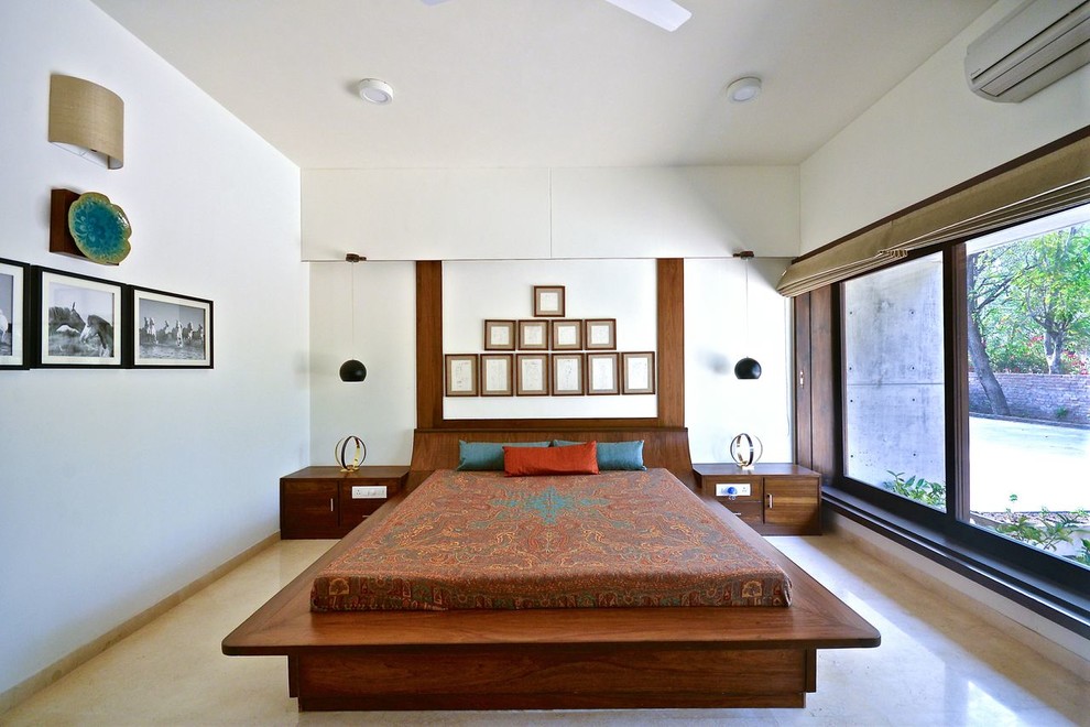 Inspiration for a mid-sized contemporary beige floor bedroom remodel in Ahmedabad with white walls