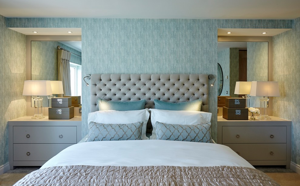 This is an example of a medium sized traditional master bedroom in Dublin with blue walls, carpet and grey floors.