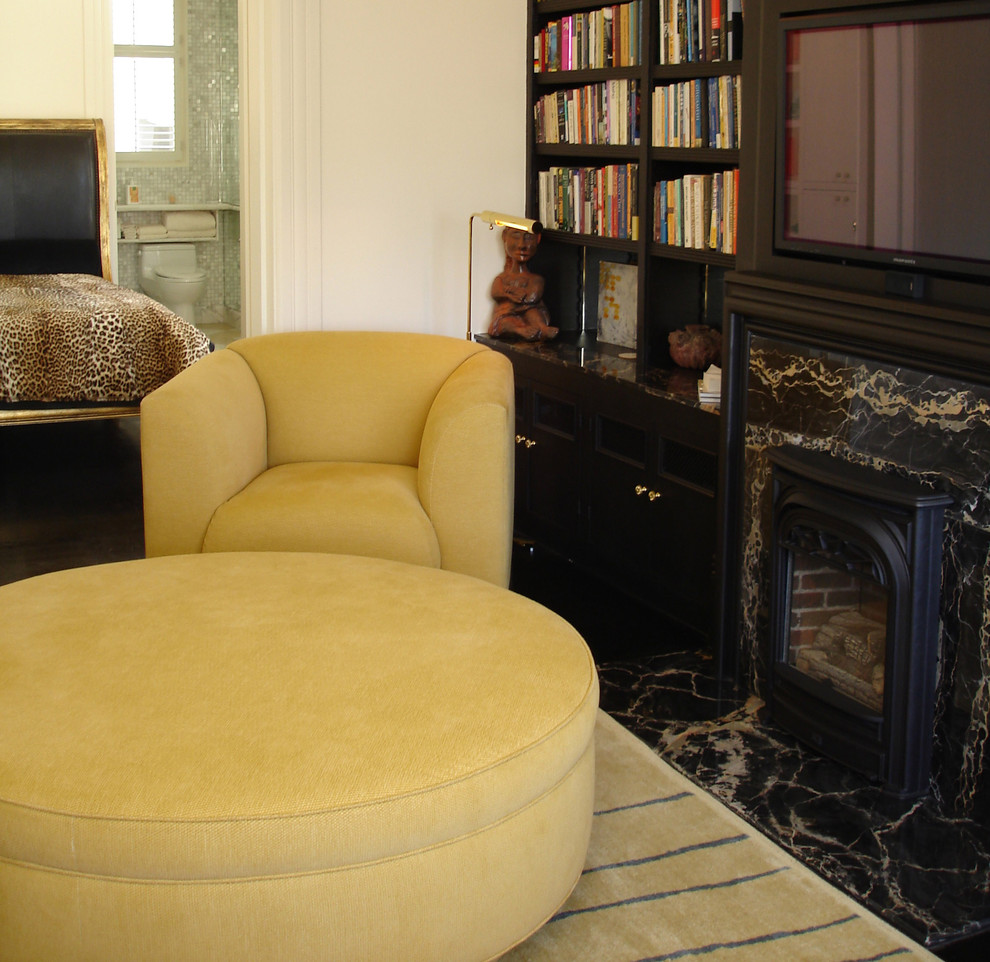 Arm chair and ottoman, bath and bed beyond. Traditional Bedroom