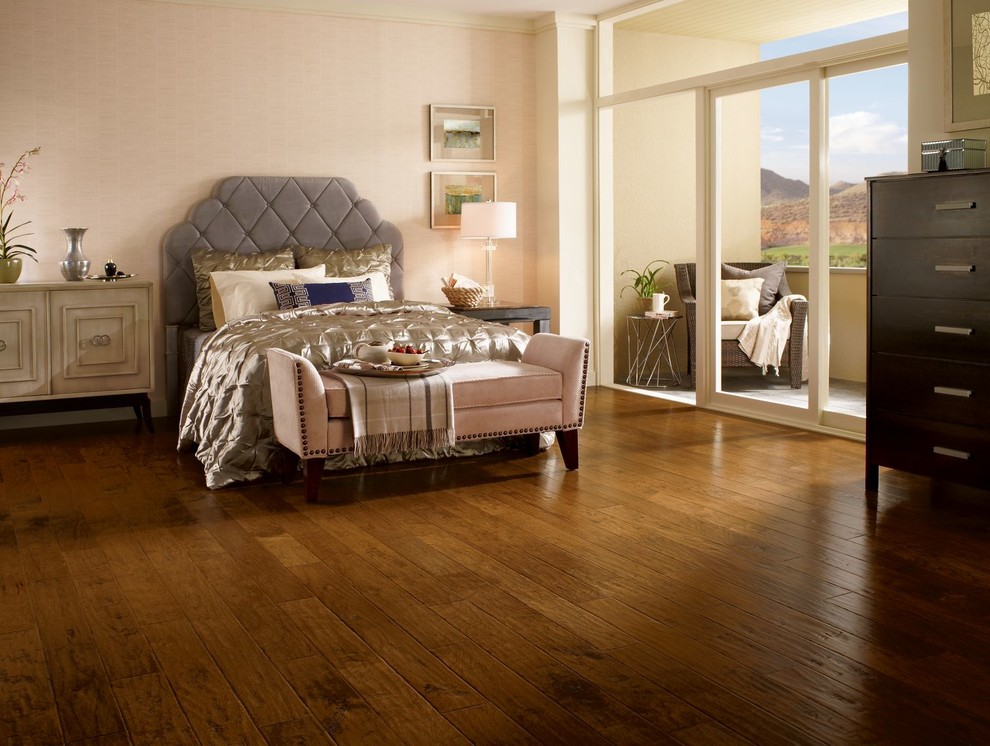 Bedroom - mid-sized traditional master medium tone wood floor and brown floor bedroom idea in Los Angeles with beige walls