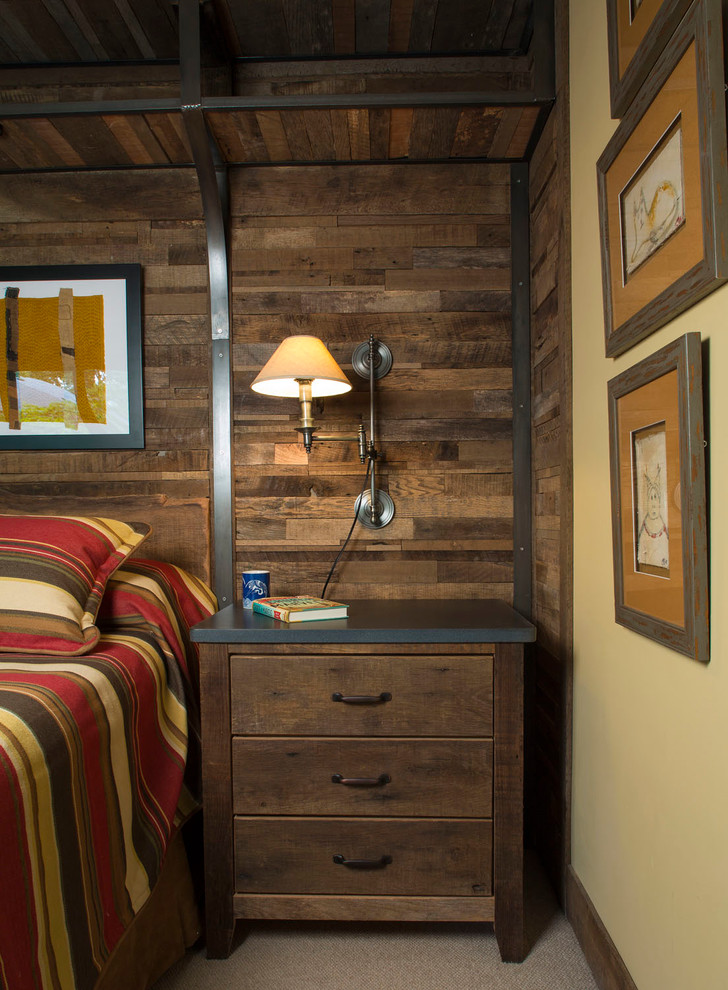 Photo of a medium sized rustic master bedroom in Other with yellow walls, carpet, no fireplace and grey floors.