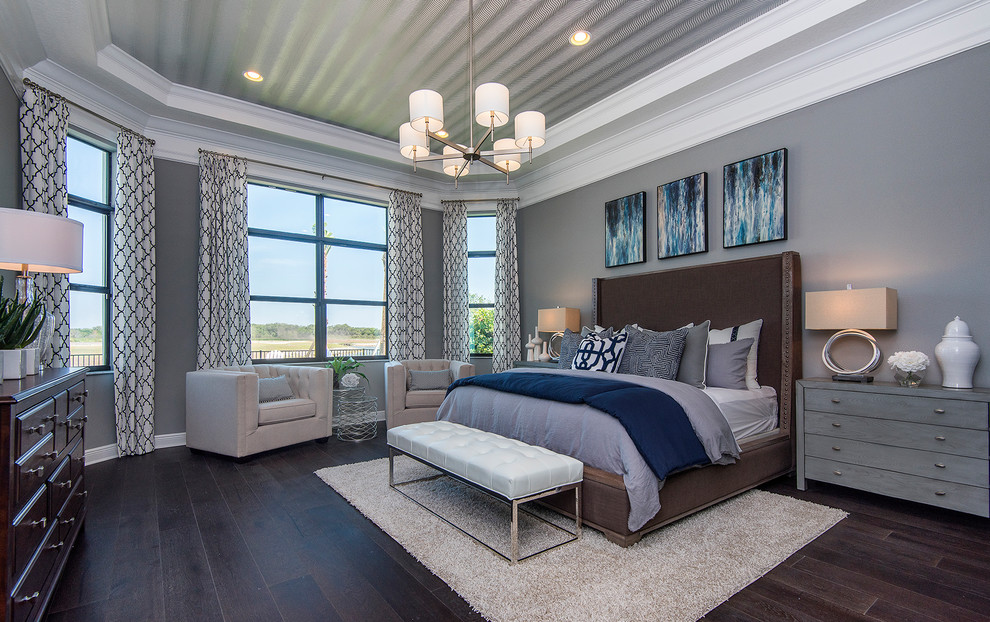 Bedroom in Tampa with brown floors and a wallpapered ceiling.