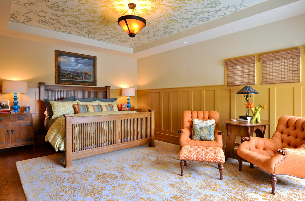 This is an example of a traditional bedroom in Austin with yellow walls.