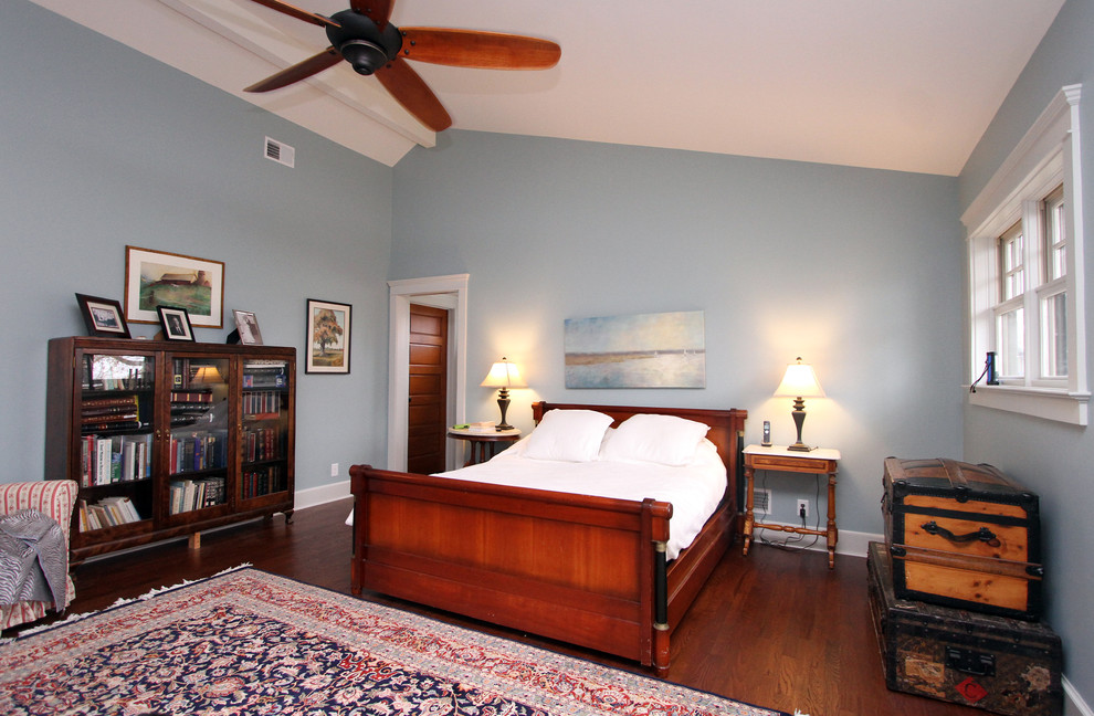 Bedroom - mid-sized craftsman master medium tone wood floor bedroom idea in New York with blue walls