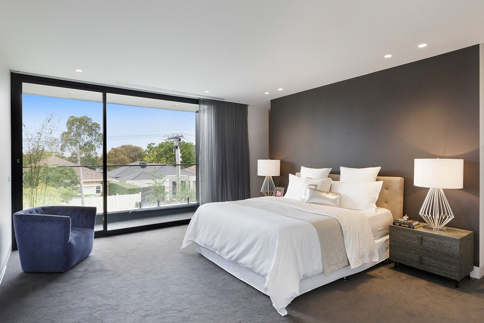 Photo of a medium sized contemporary master bedroom in Melbourne with carpet, grey walls and grey floors.