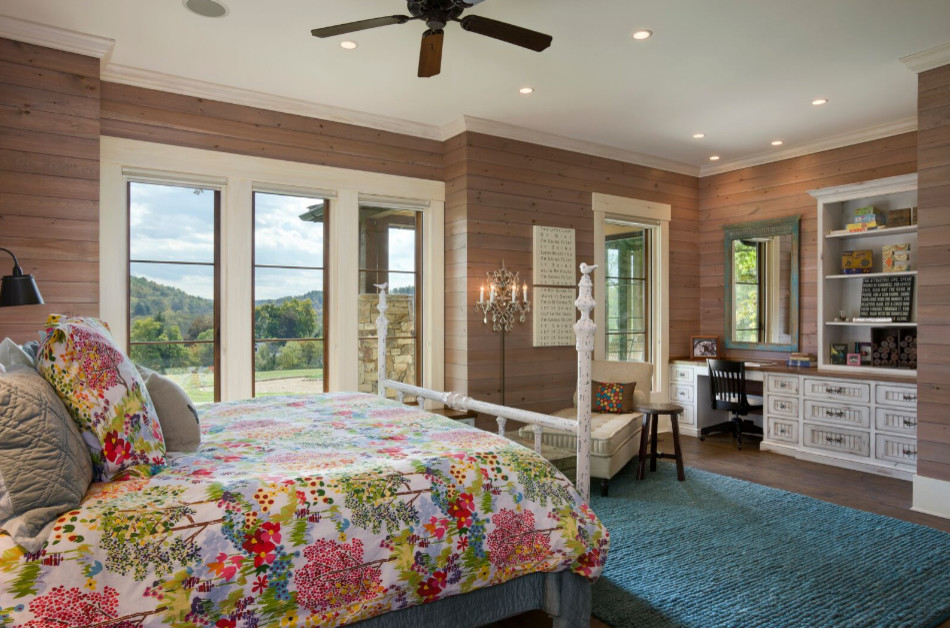 Inspiration for a large country master dark wood floor bedroom remodel in Other with brown walls and no fireplace
