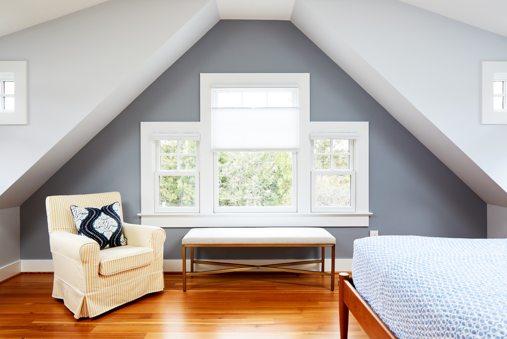 Mid-sized transitional master medium tone wood floor bedroom photo in DC Metro with blue walls