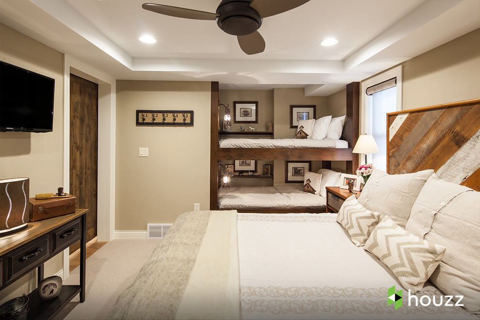 Example of a mountain style guest medium tone wood floor bedroom design in Other with beige walls and no fireplace