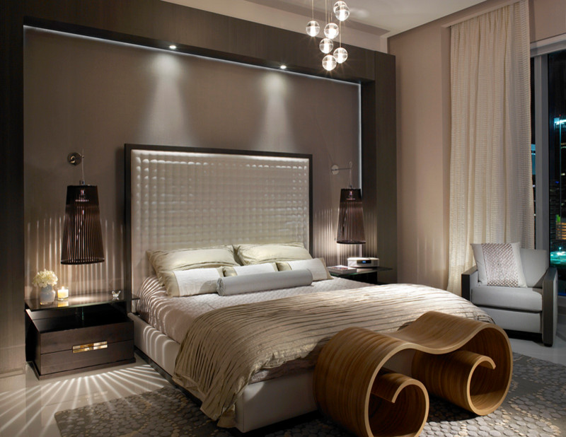 Bedroom - large contemporary marble floor bedroom idea in Miami with beige walls