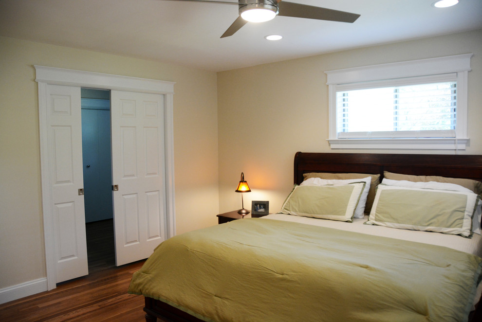 Mid-sized transitional master medium tone wood floor bedroom photo in DC Metro with beige walls and no fireplace