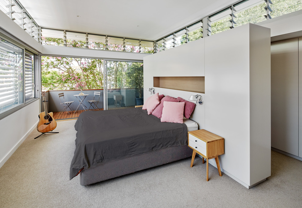 Design ideas for a large contemporary master and grey and pink bedroom in Sydney with carpet.
