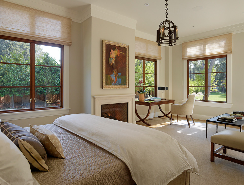 Design ideas for a classic bedroom in San Francisco with beige walls and a standard fireplace.