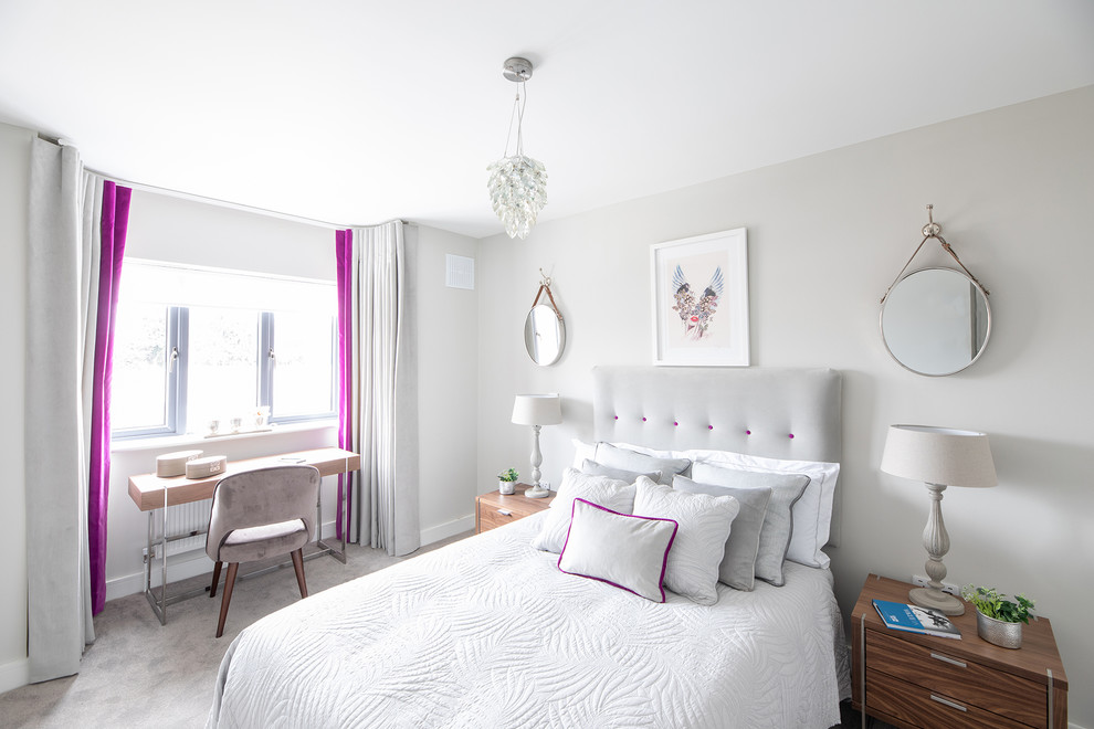 This is an example of a contemporary guest and grey and pink bedroom in Dublin with grey walls, carpet and grey floors.