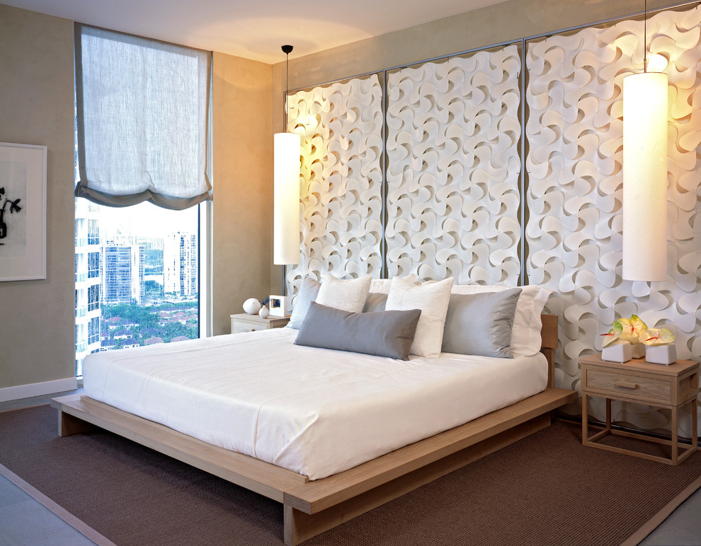 This is an example of a contemporary master bedroom in Denver with beige walls, no fireplace and a feature wall.