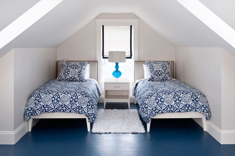 Example of a trendy blue floor bedroom design in Boston with gray walls