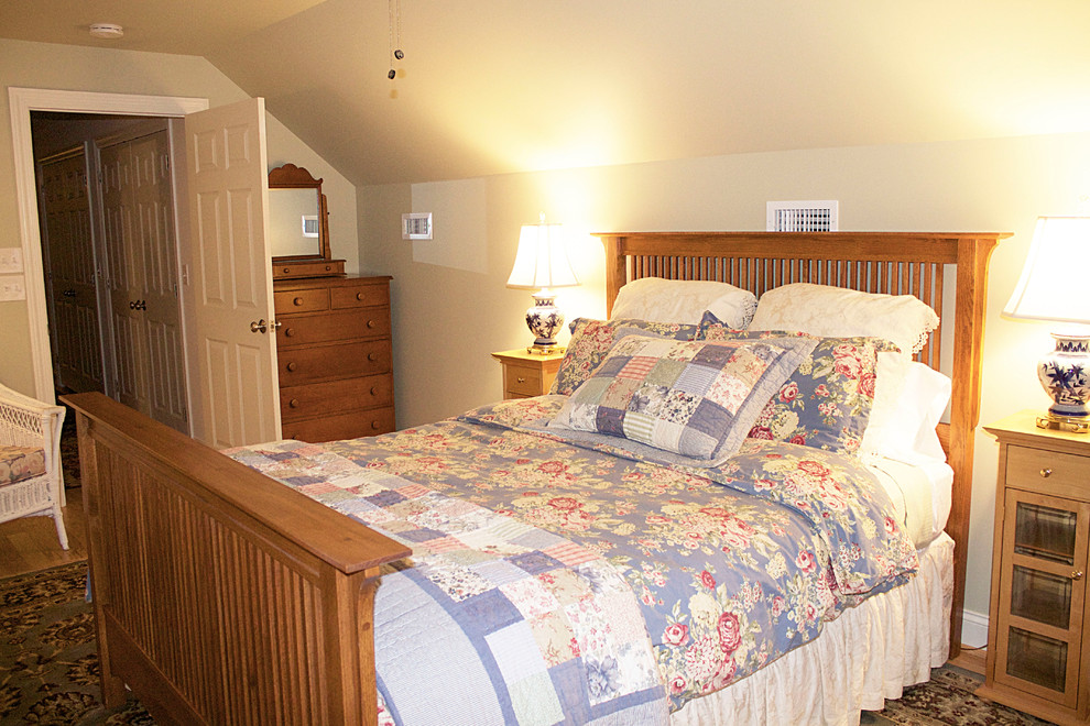 Medium sized traditional guest bedroom in Other with green walls, medium hardwood flooring and no fireplace.