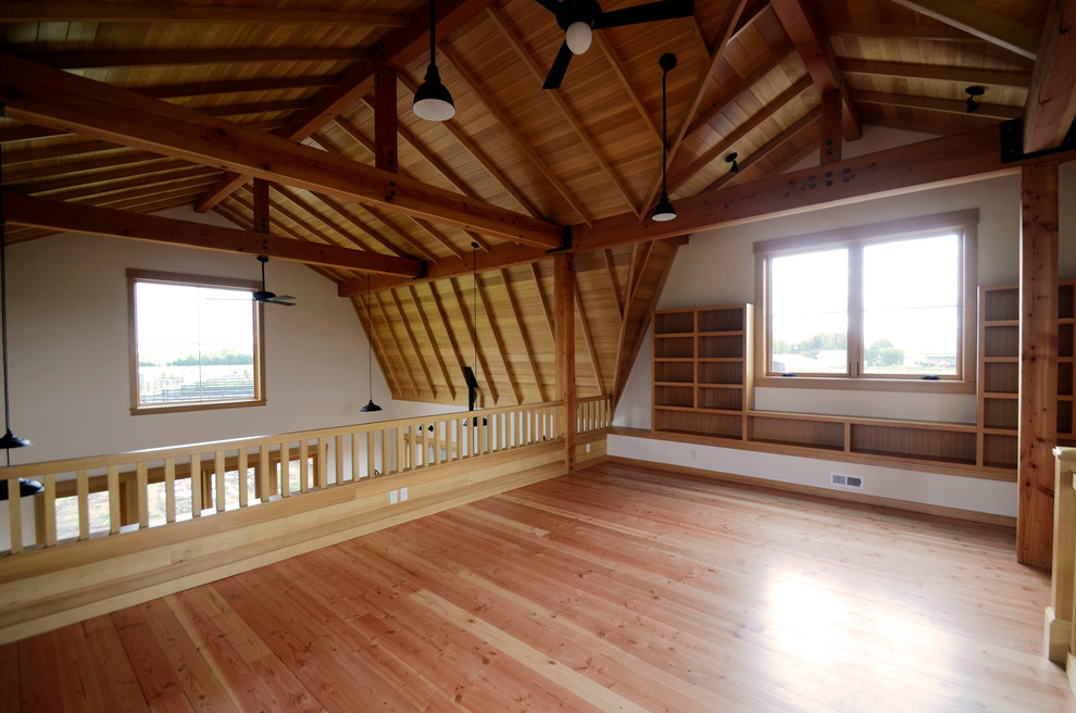 Inspiration for a farmhouse mezzanine bedroom in Portland with white walls and light hardwood flooring.