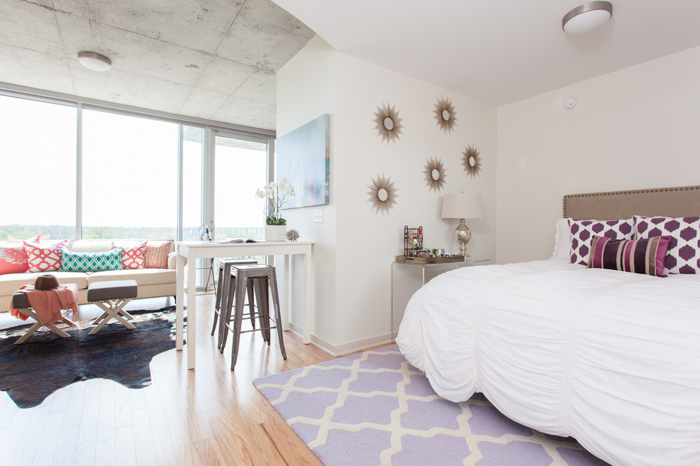 Small danish light wood floor bedroom photo in Austin with white walls