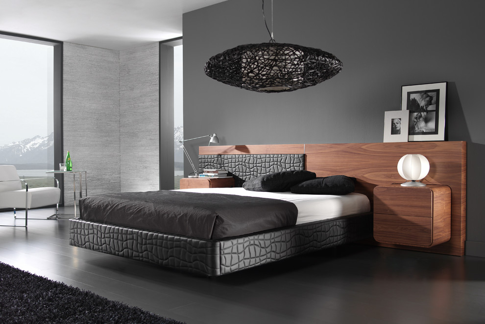 Modern inredning av ett mellanstort sovrum, med grå väggar