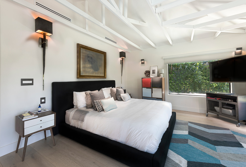 Bedroom - contemporary light wood floor bedroom idea in Miami with white walls and no fireplace