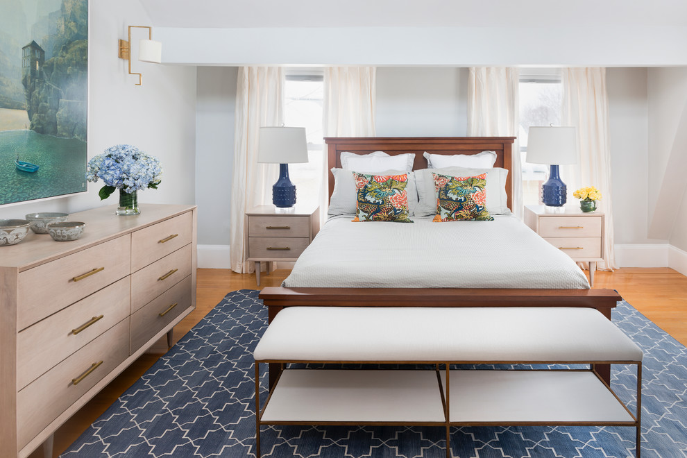 Example of a transitional master bedroom design in Boston with gray walls