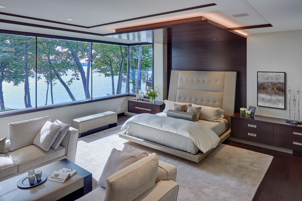 Inspiration for a contemporary master bedroom in Detroit with beige walls, dark hardwood flooring and brown floors.