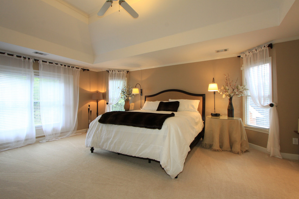 Large classic master bedroom in Atlanta with beige walls, carpet, no fireplace and beige floors.