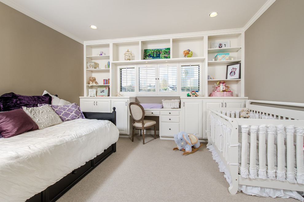 Example of a small classic master carpeted bedroom design in Los Angeles with beige walls