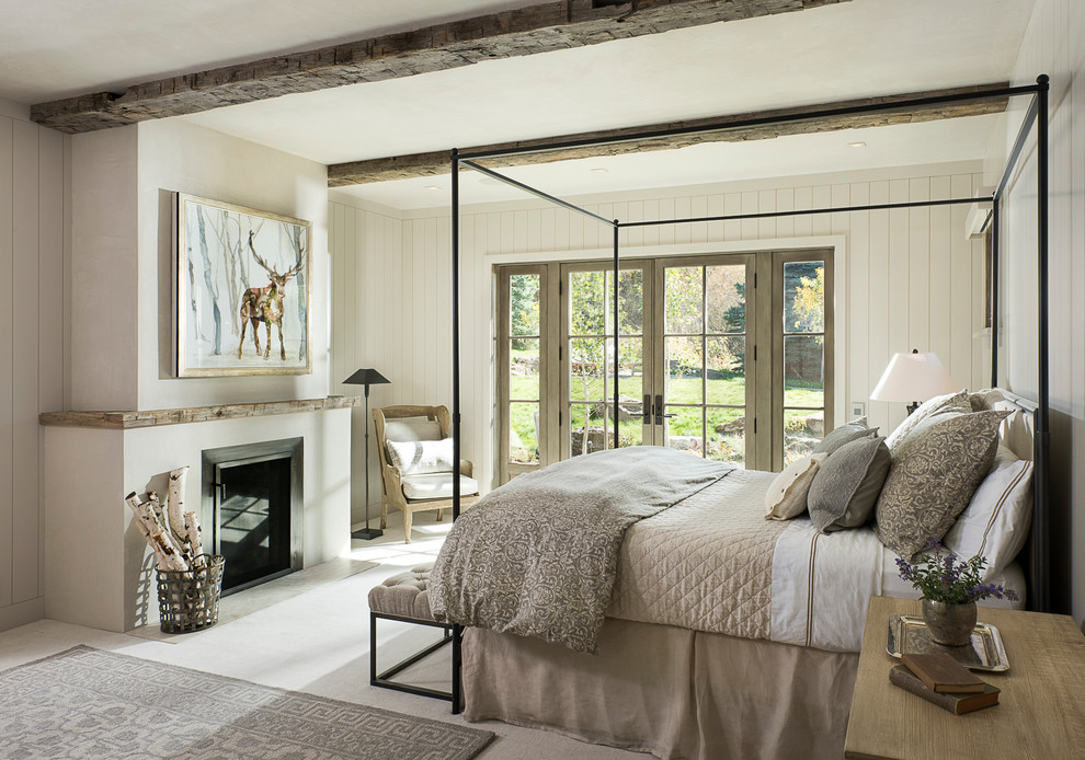 Mountain style bedroom photo in Other with white walls and a standard fireplace