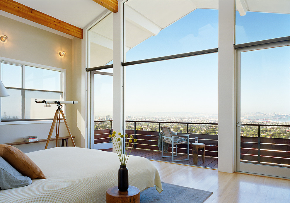 This is an example of a contemporary bedroom in San Francisco with light hardwood flooring.